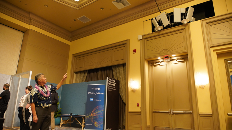 Here’s the Governor of Hawaii pointing at some 5G base stations set up for Qualcomm’s tech summit.